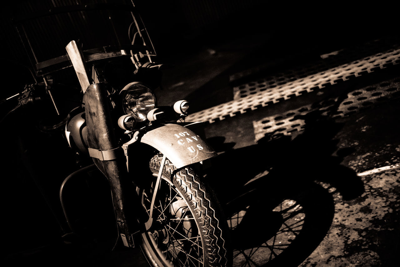 HIGH ANGLE VIEW OF BICYCLE PARKED ON WALL