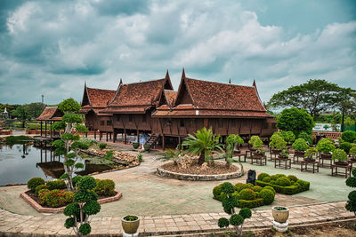 Temple by building against sky