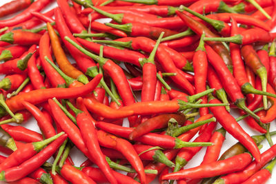 Full frame shot of red chili peppers for sale at market