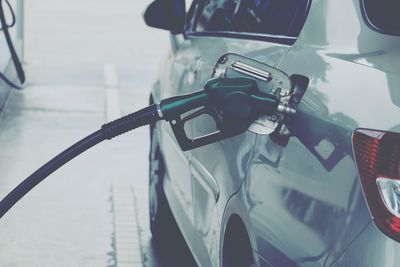 Close-up of car refueling at gas station