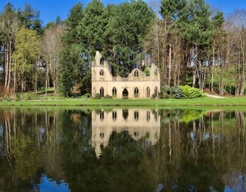 Ruined abbey across a lake. 