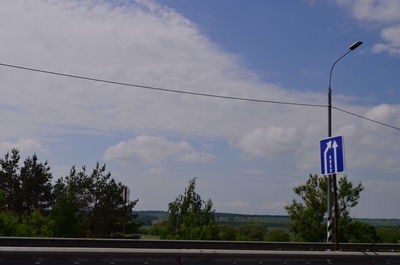 Road by street against sky