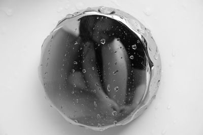 Close-up of water over white background