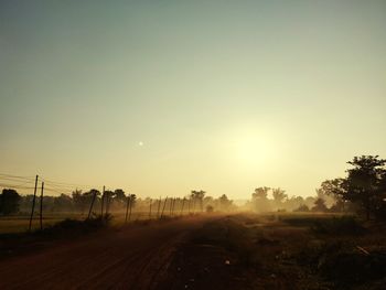 Scenic view of landscape against clear sky during sunset