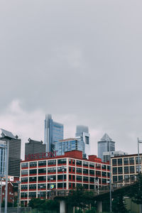 Low angle view of buildings against sky in city