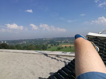 Low section of man relaxing on ground