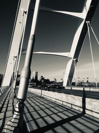 Bridge against sky in city