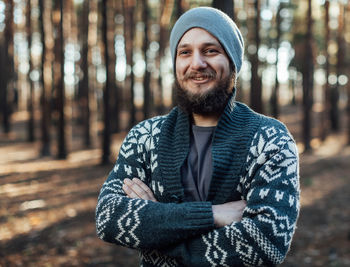 Portrait of smiling young man standing outdoors