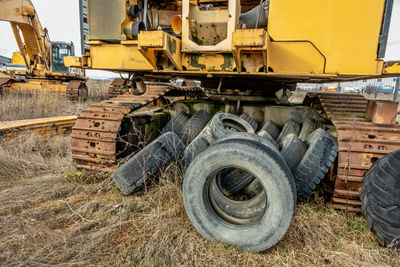 Crawler excavator and truck tires abandoned