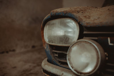 Close-up of old abandoned car