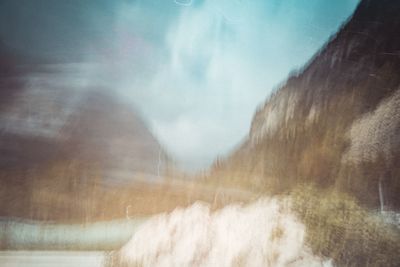 Defocused image of waterfall against sky