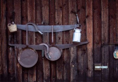 Close-up of metallic hanging on wood