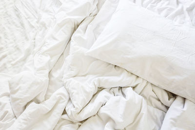 High angle view of white blanket on bed at home