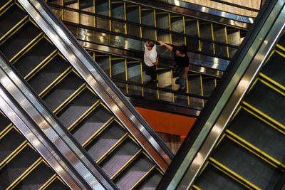High angle view of people on escalator