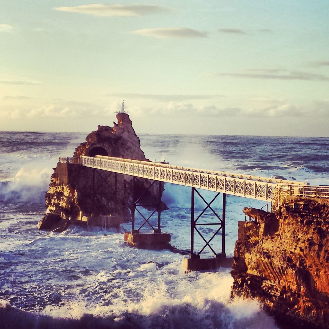 sea, horizon over water, water, sky, beach, scenics, built structure, tranquil scene, shore, tranquility, architecture, nature, beauty in nature, rock - object, cloud - sky, wave, protection, lighthouse, idyllic, remote