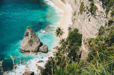 High angle view of rocks on sea