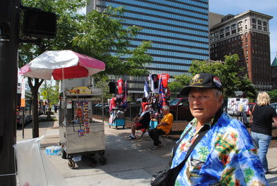 Woman standing on city street