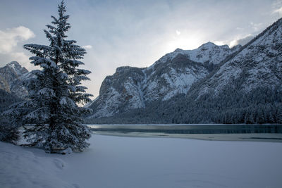 Scenic view of snowcapped mountains against sky during winter