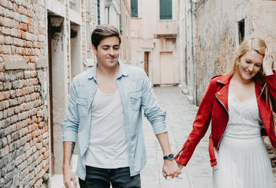 Young couple smiling in city