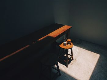 High angle view of empty chair on table at home