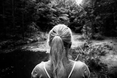 Rear view of woman looking at forest
