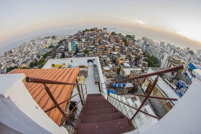 High angle view of townscape by building against sky