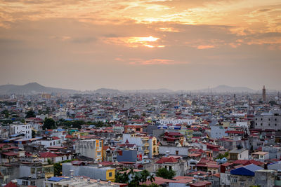 High angle view of townscape against sky at sunset