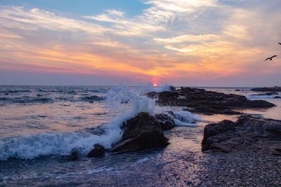 Scenic view of sea against sky during sunset