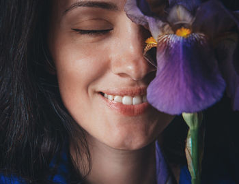 Close-up portrait of a smiling young woman