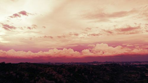 Scenic view of landscape against sky at sunset