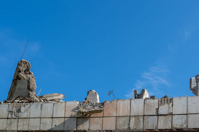 Low angle view of statue against clear blue sky