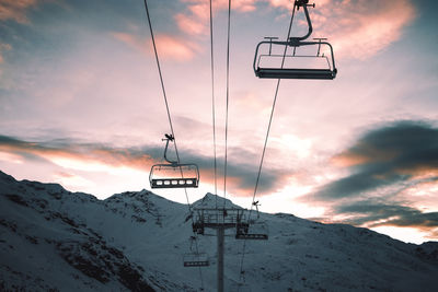 Overhead cable car against sky during winter