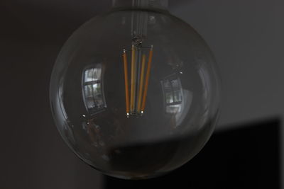 Close-up of illuminated light bulb