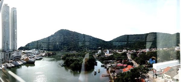 Panoramic view of city buildings against clear sky