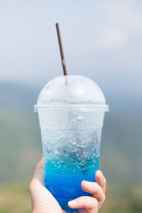 Close-up of hand holding ice cream cone