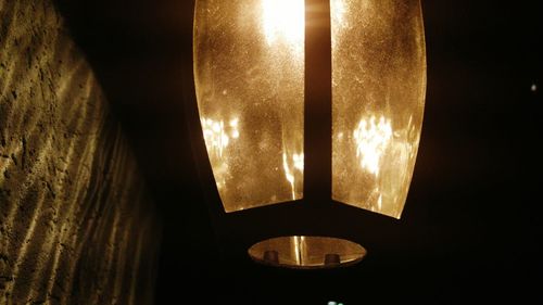 Low angle view of lit lamp