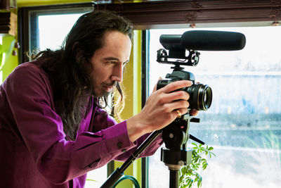 Man photographing with camera