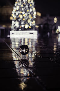 Close-up of illuminated lighting equipment on table