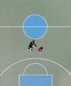 High angle view of man playing with ball