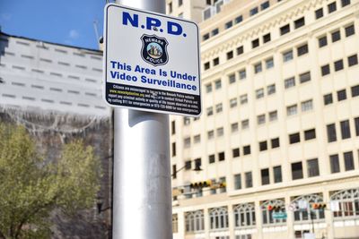 Information sign on road in city