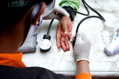 The medical team conducted a health check on one of the funeral attendants in jakarta, indonesia.