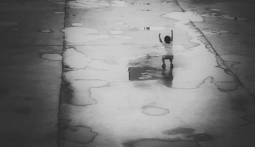 Reflection of clouds in puddle