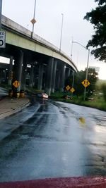 Cars on road against sky