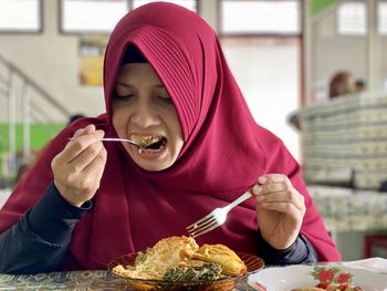 Portrait of man eating food