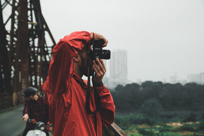 Woman photographing with camera
