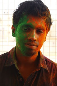 Portrait of man with face paint during holi