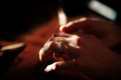 Colored stone ring on hand