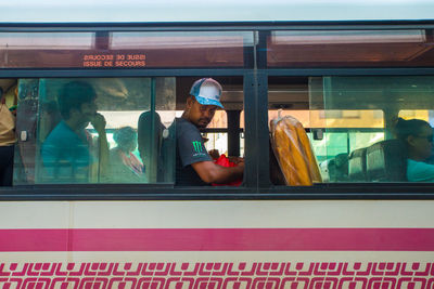 Reflection of people on glass window