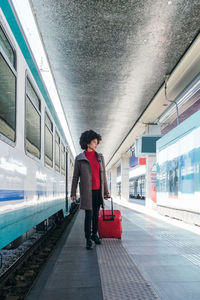 Elegant woman going for business trip on train
