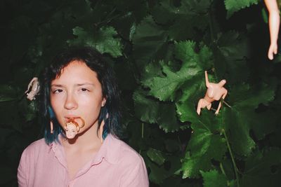 Portrait of woman eating leaves